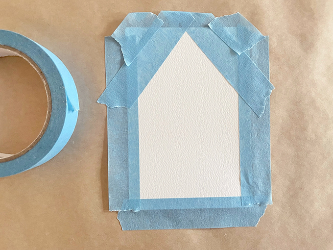 Fabriquez une guirlande de maison peinte en utilisant une technique d'aquarelle liquide et de ruban adhésif.